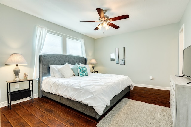 bedroom with dark wood-type flooring and ceiling fan