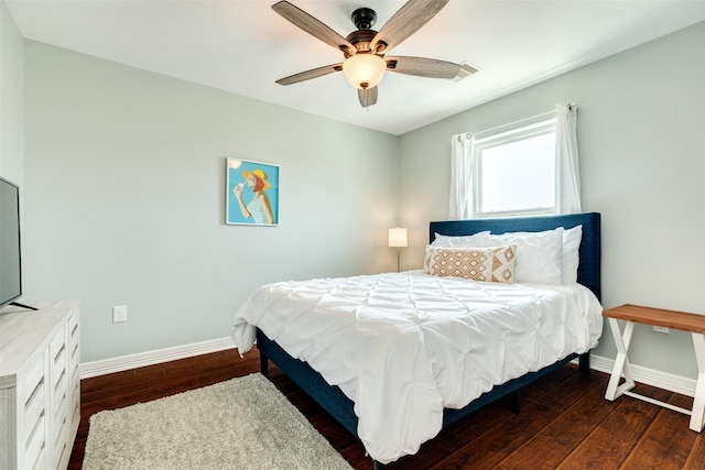 bedroom featuring ceiling fan and dark hardwood / wood-style floors