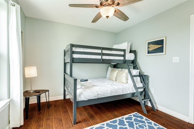 bedroom featuring ceiling fan and dark hardwood / wood-style flooring