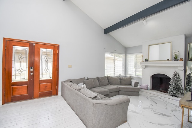 living room with beam ceiling, french doors, and high vaulted ceiling