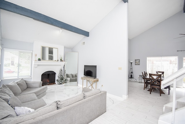 living room featuring light hardwood / wood-style floors, beam ceiling, high vaulted ceiling, and ceiling fan