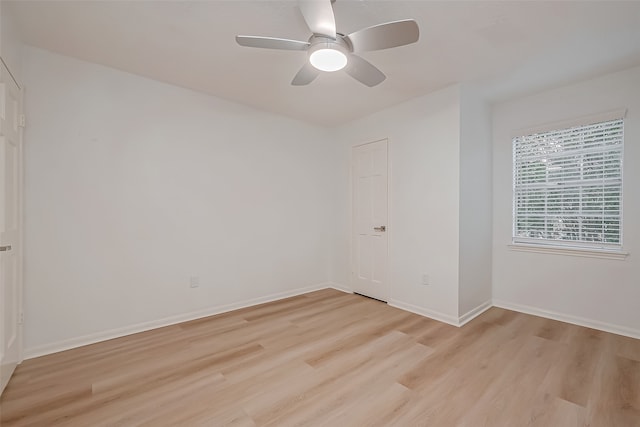 unfurnished room featuring ceiling fan and light hardwood / wood-style flooring