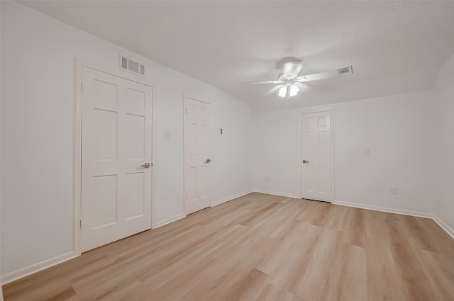 spare room featuring ceiling fan and light wood-type flooring