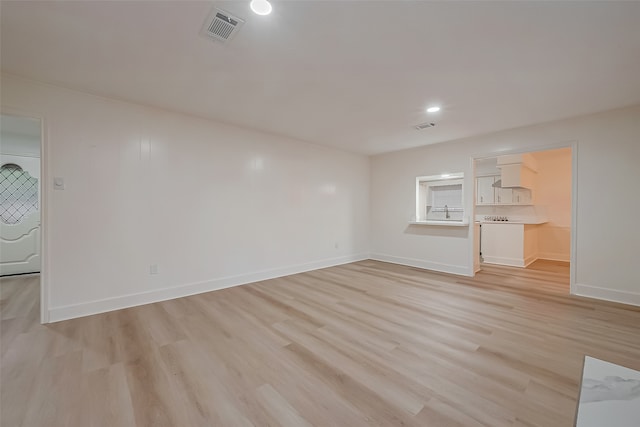 unfurnished living room featuring light wood-type flooring