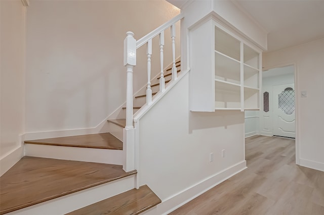 stairway with wood-type flooring