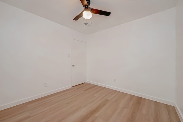 unfurnished room with ceiling fan and light wood-type flooring