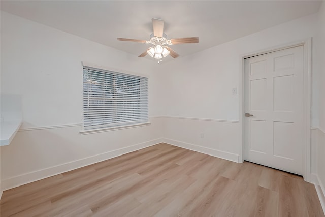 unfurnished room featuring light hardwood / wood-style floors and ceiling fan