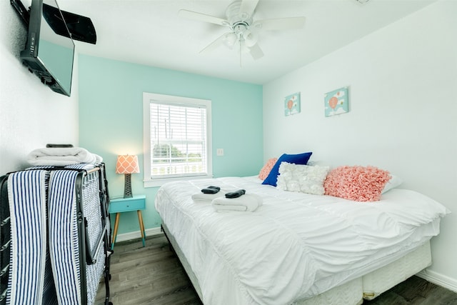 bedroom featuring dark wood-type flooring and ceiling fan