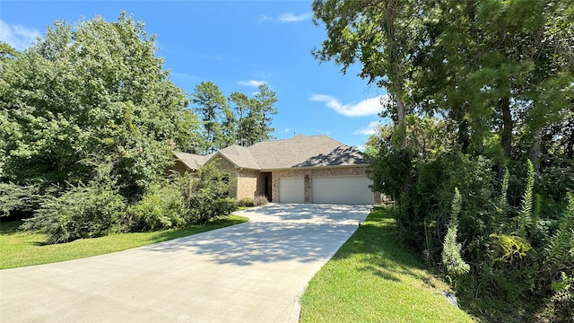 view of front facade featuring a front yard and a garage