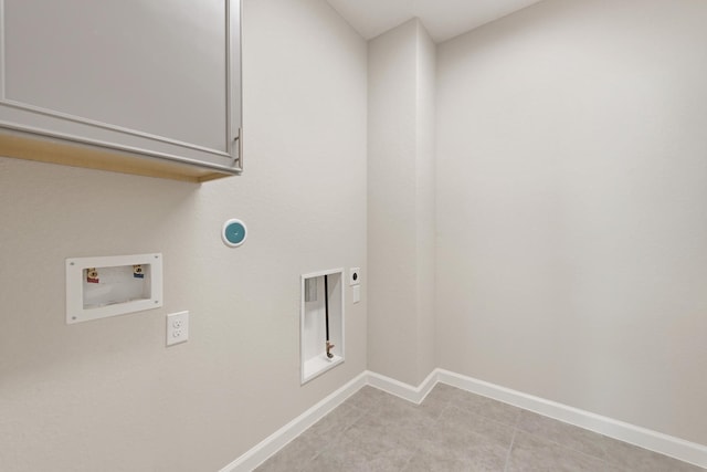 washroom featuring hookup for a washing machine, light tile patterned floors, cabinets, and hookup for an electric dryer