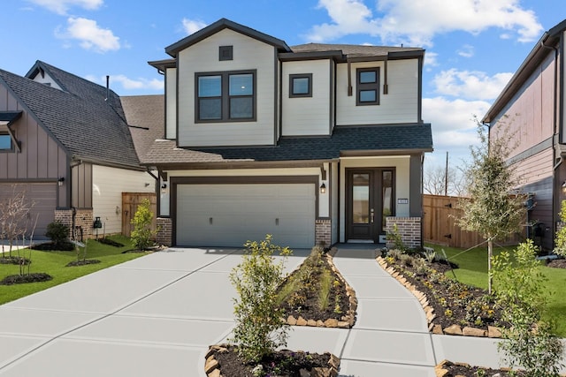 view of front of property with concrete driveway, roof with shingles, an attached garage, fence, and brick siding