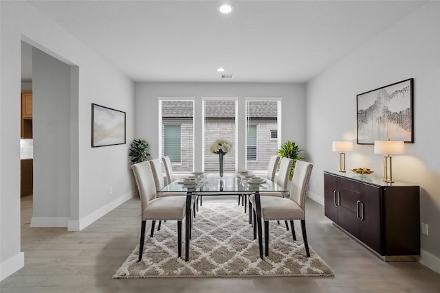 dining space featuring light hardwood / wood-style flooring