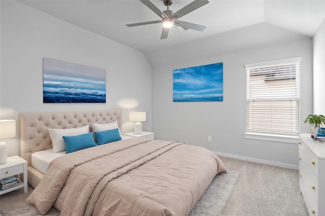 bedroom featuring ceiling fan, light carpet, and vaulted ceiling