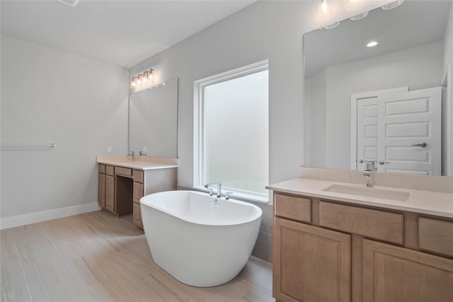 bathroom featuring a tub and vanity