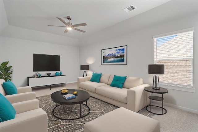 living room with ceiling fan and carpet flooring