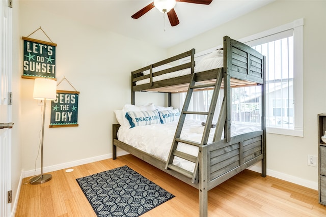 bedroom featuring ceiling fan and hardwood / wood-style flooring