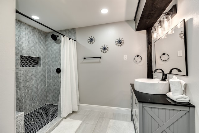 bathroom with vanity and curtained shower