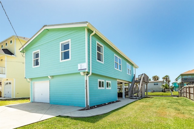 exterior space featuring a lawn and a garage