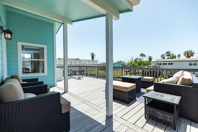 wooden deck featuring an outdoor hangout area