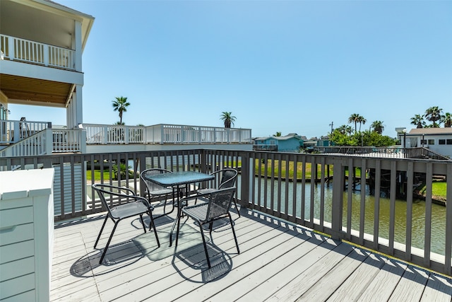 deck featuring a water view