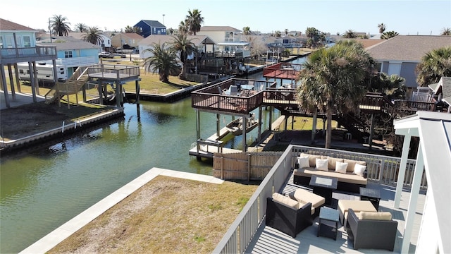 dock area featuring outdoor lounge area and a water view