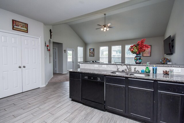 kitchen featuring a sink, black dishwasher, dark cabinetry, light stone countertops, and ceiling fan
