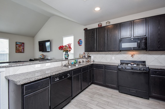 kitchen with light hardwood / wood-style floors, sink, lofted ceiling, black appliances, and backsplash