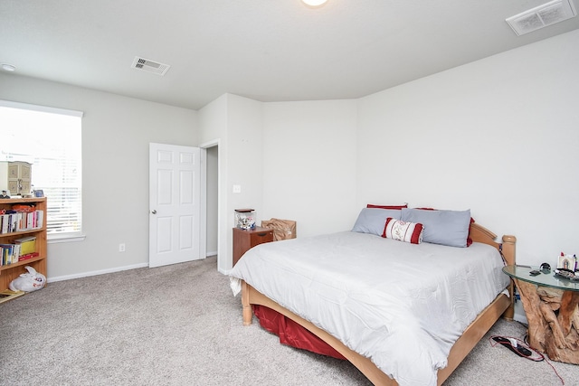 bedroom with visible vents, carpet floors, and baseboards