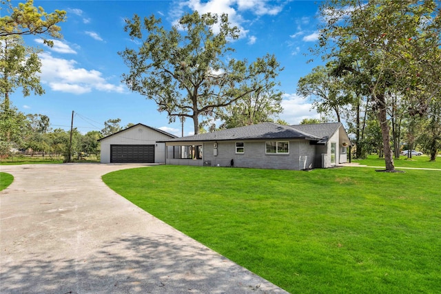 single story home with a garage and a front yard