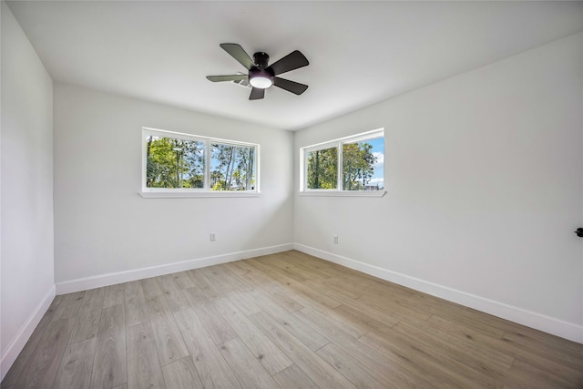 unfurnished room with light wood-type flooring and ceiling fan