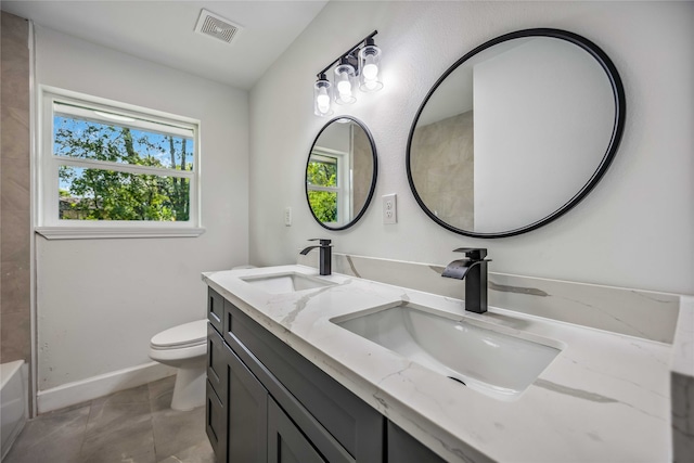 bathroom with a bath, tile patterned flooring, vanity, and toilet