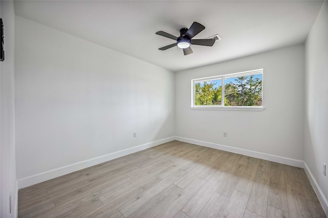 empty room with light wood-type flooring and ceiling fan