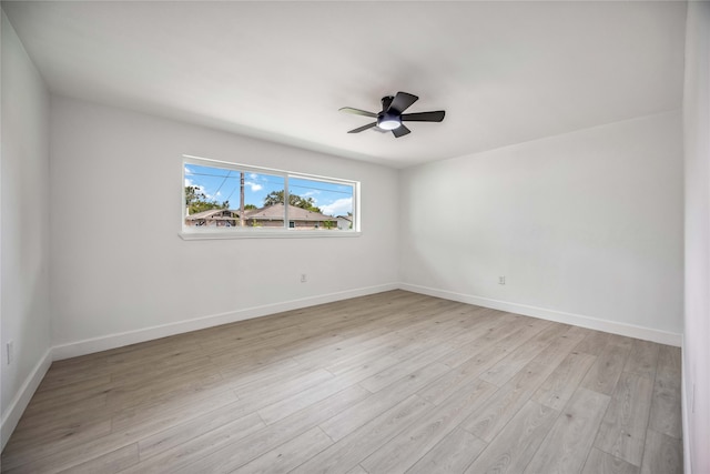 spare room with light hardwood / wood-style flooring and ceiling fan