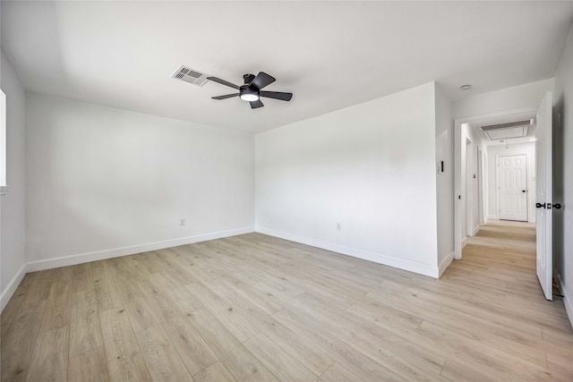 spare room featuring light hardwood / wood-style floors and ceiling fan