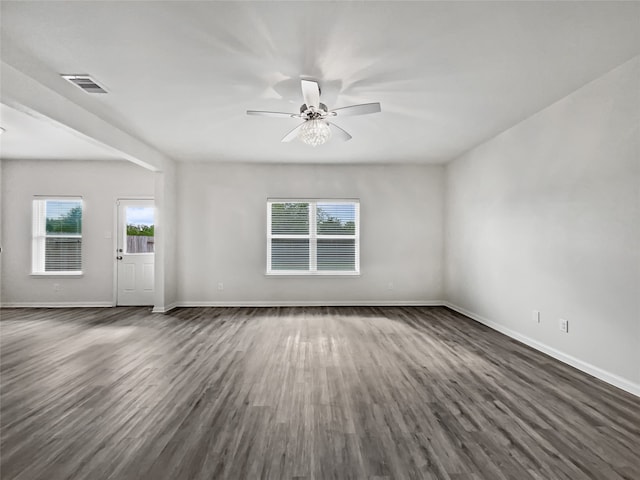 interior space with ceiling fan and dark hardwood / wood-style flooring