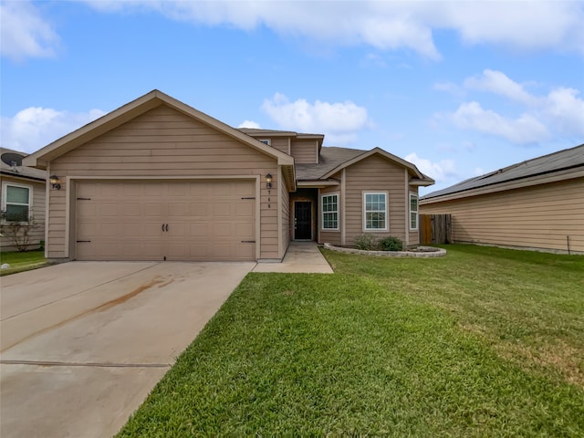 view of front of house with a front yard and a garage