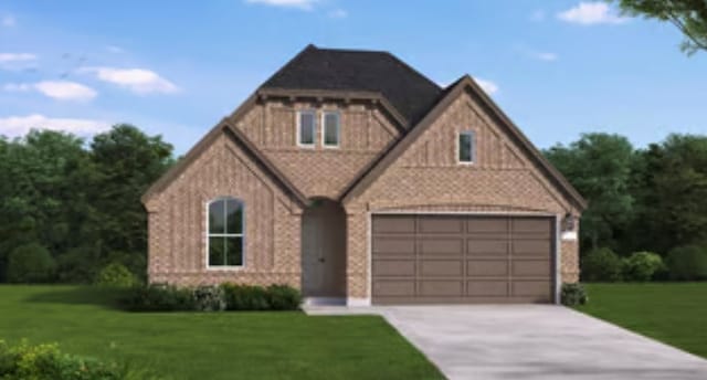 view of front of property featuring a garage and a front lawn