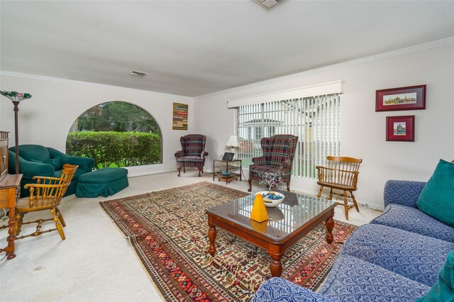 carpeted living room with ornamental molding