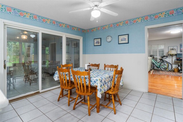 dining room with ceiling fan and light hardwood / wood-style floors