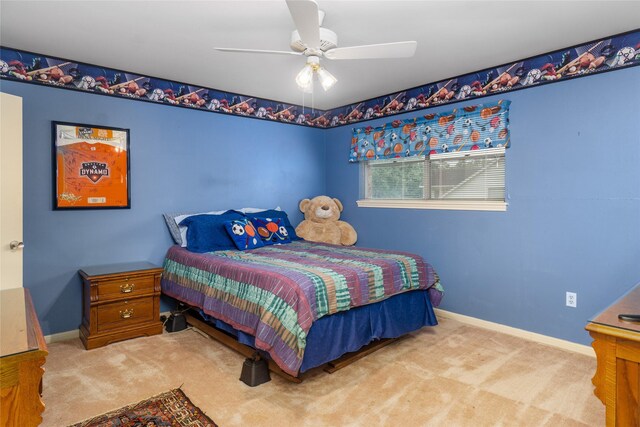 bedroom featuring ceiling fan and light carpet