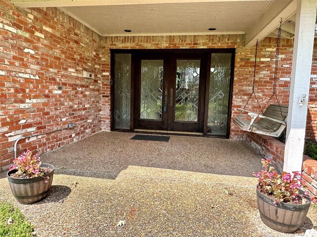 property entrance featuring french doors