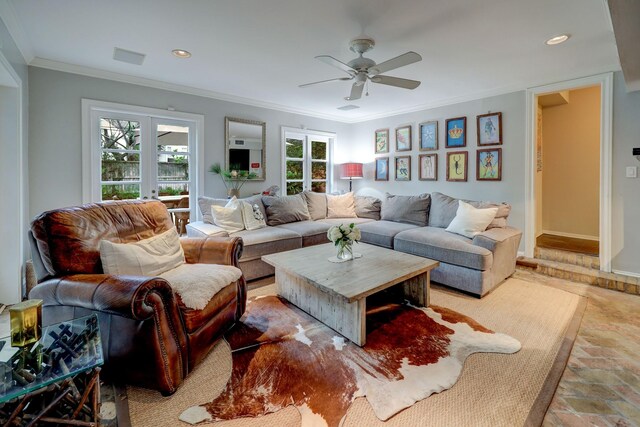 living room featuring crown molding and ceiling fan