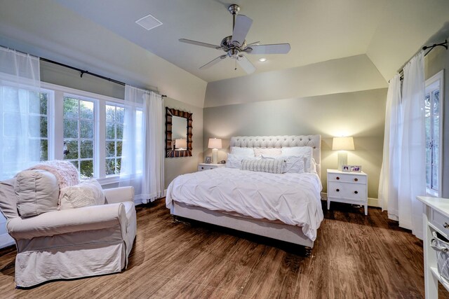 bedroom with ceiling fan, vaulted ceiling, and dark wood-type flooring