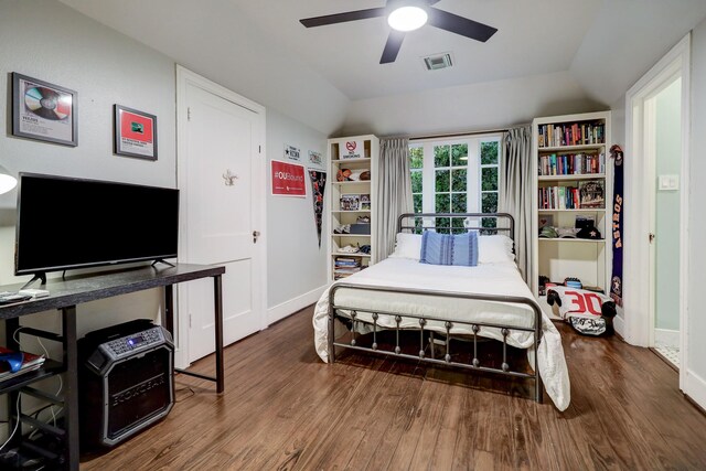 bedroom with lofted ceiling, dark wood-type flooring, and ceiling fan