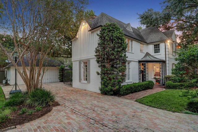 view of front of house with an outbuilding and a garage