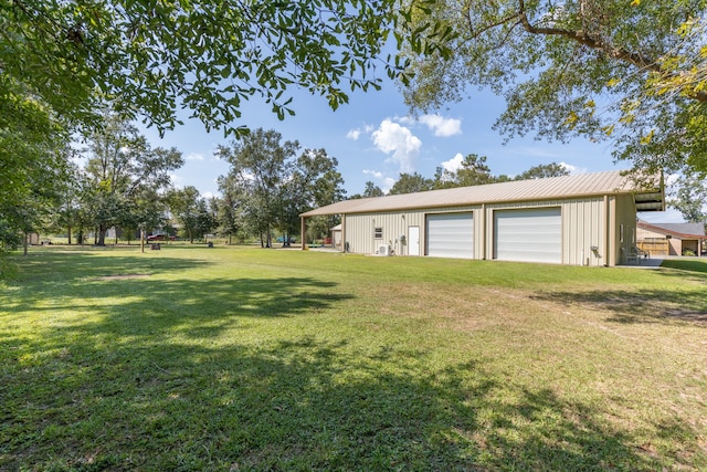 view of yard with an outdoor structure and a garage