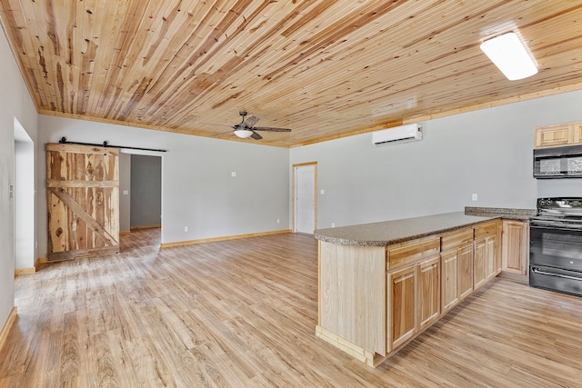 kitchen with wood ceiling, a barn door, ceiling fan, and black appliances