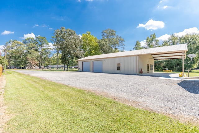 exterior space featuring a lawn and a carport