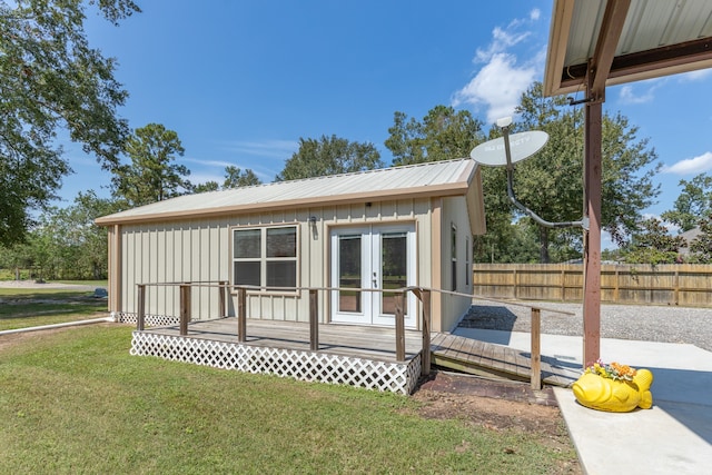 exterior space with a yard and french doors