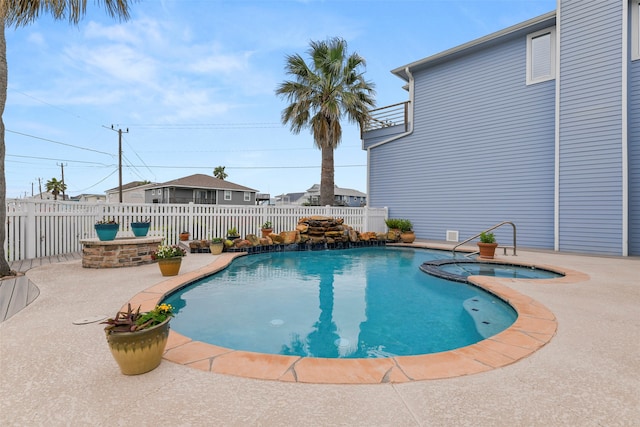 view of pool featuring an in ground hot tub and a patio